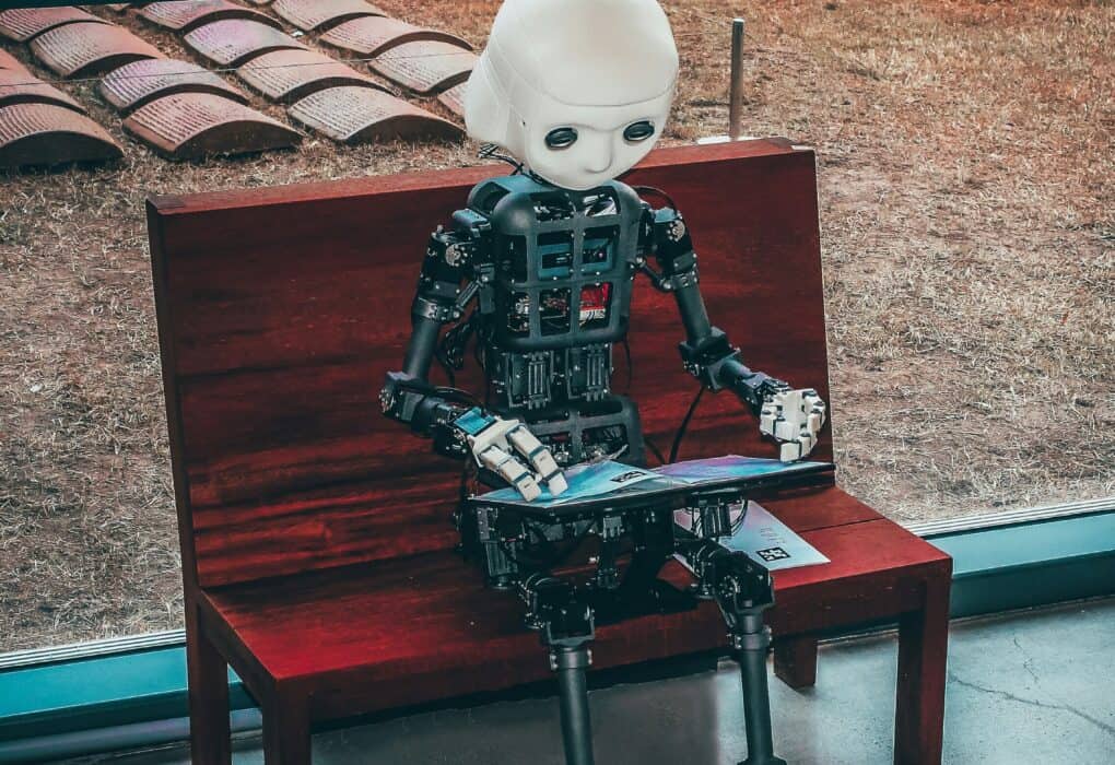 a robot sitting on a bench